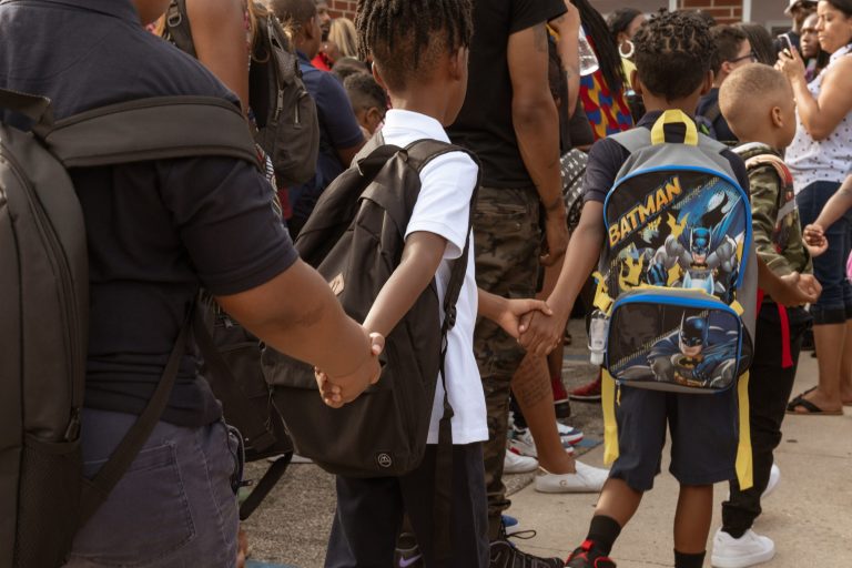 Photo of children walking into school by Caroline Gutman for Chalkbeat Philadelphia