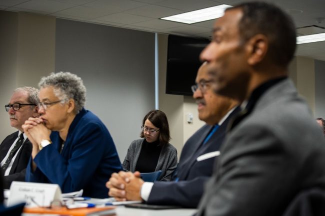 image1 Five individuals pictured at a public meeting