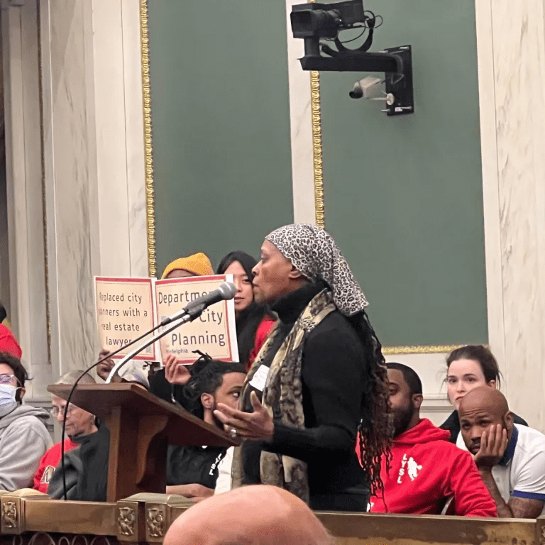 Photo of Celia Bernhardt giving public comment.