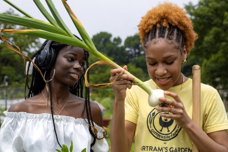 Hawa Kamara and Ain Dantzler, youth workers at Bartram's Garden, Sankofa Community Farm. Photo by Azella Gardens