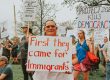 Protestor holding sign saying "First they came for immigrants."