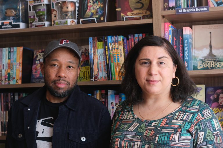 Gralin and Sara Zia Ebrahimi Hughes in their Chestnut Hill bookstore Multiverse, which specializes in comics, sci-fi, horror, and fantasy, or speculative fiction.