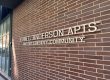 A photo of the sign on the building of the John C. Anderson Apartments in Philadelphia's Gayborhood.