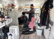 Siddiq, owner of Nicecutz Barber Truck cuts the hair of a customer.